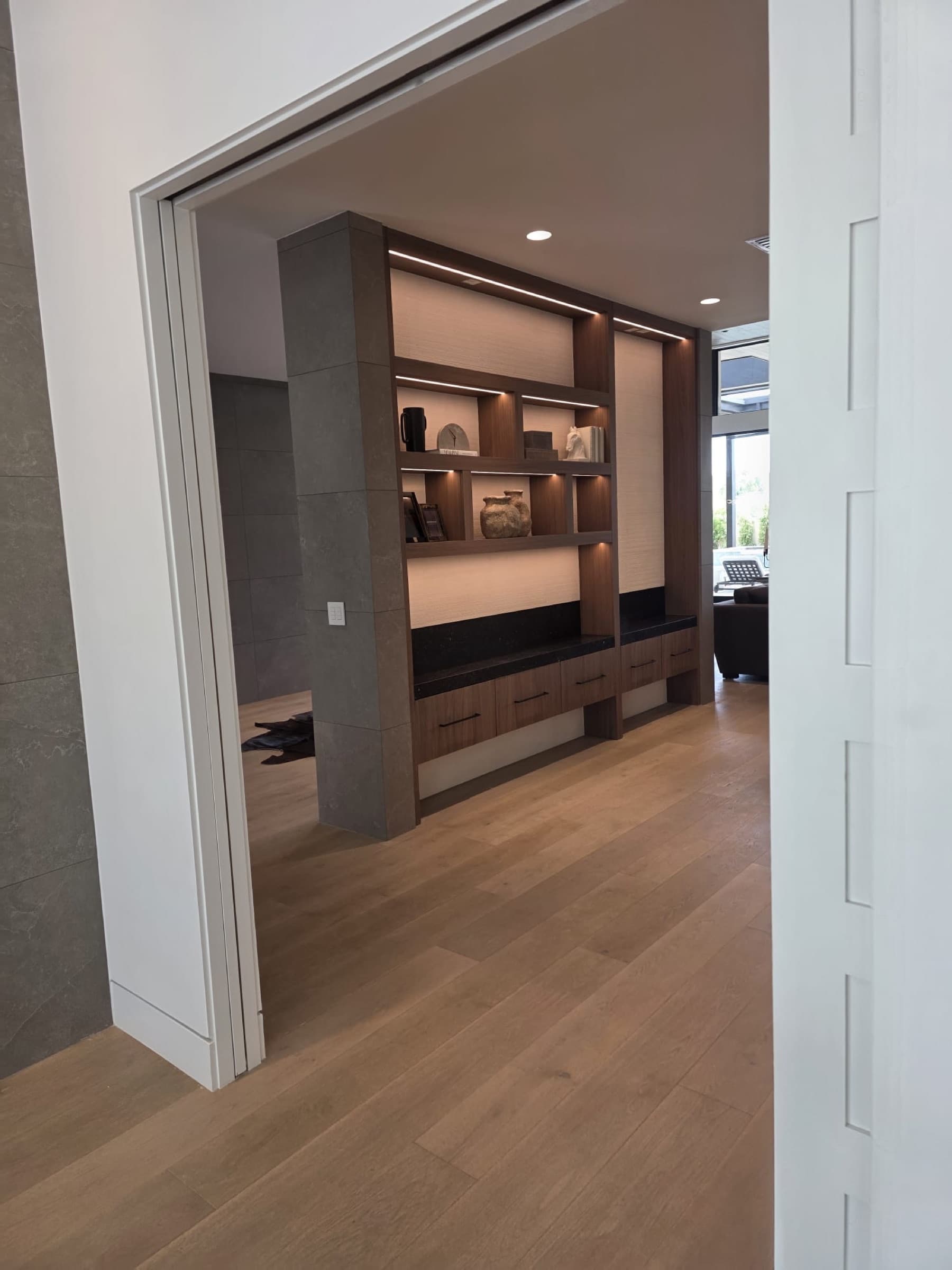 Warm wood custom built-ins with integrated lighting